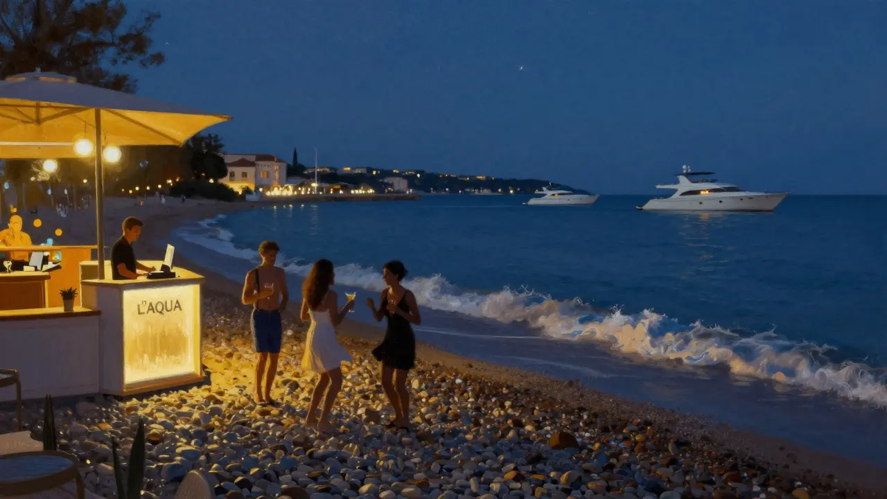 Exclusive L’Aqua beach club at night with guests dancing near ocean waves under starry sky.