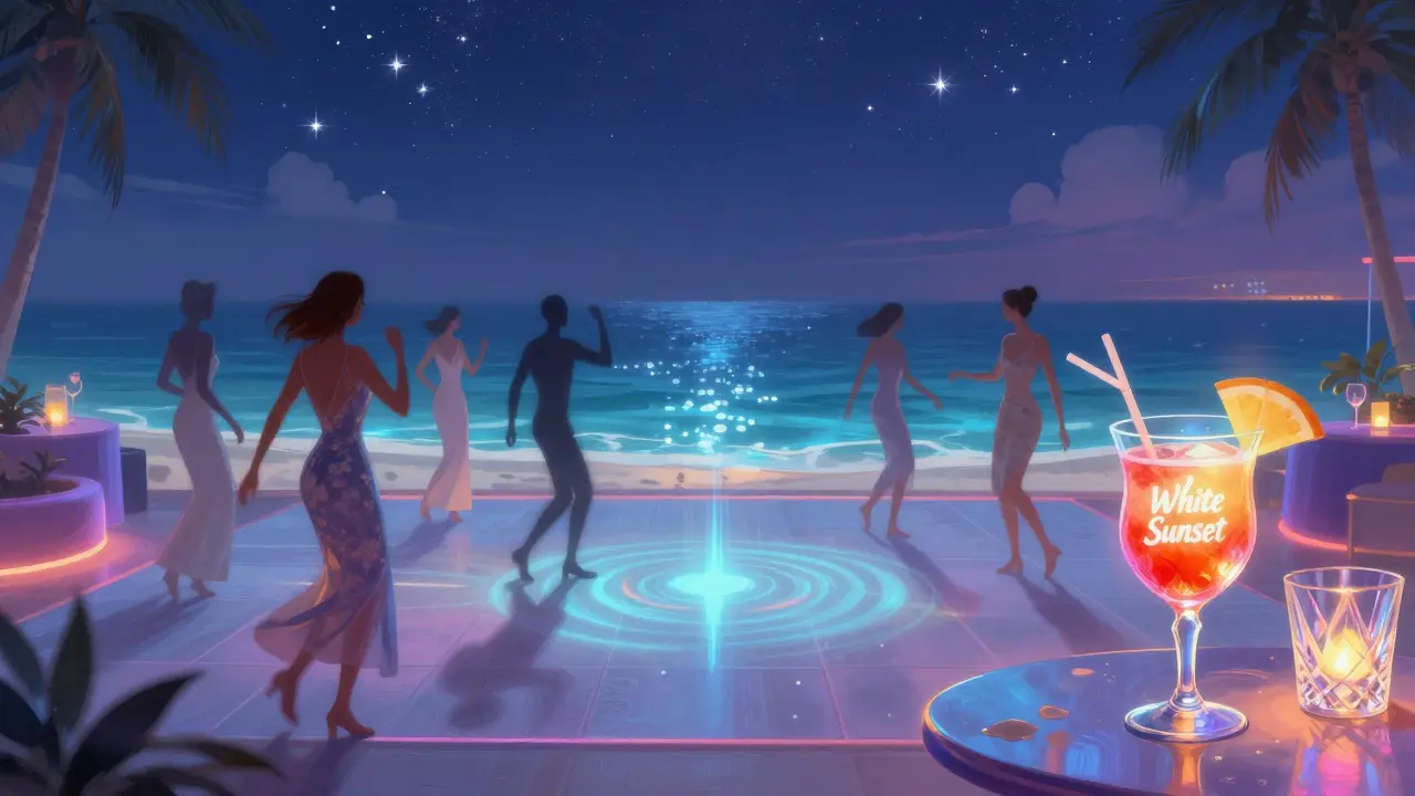 Elegant guests dancing on a glowing oceanfront floor at White Dubai at night.